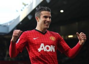 Robin van Persie of Manchester United celebrates scoring the opening goal of the game